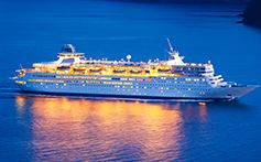 cruise ship in ocean at night