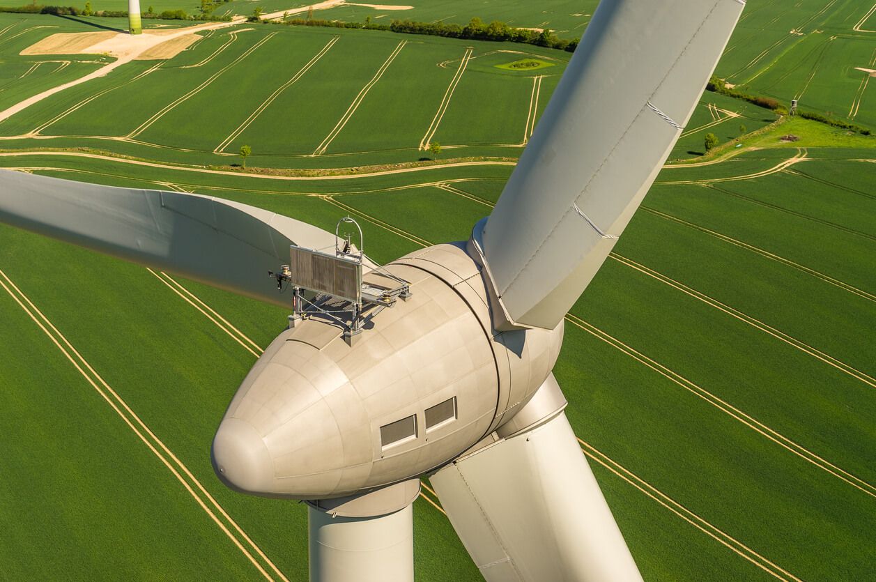 windmill above farmland