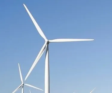 windmill in front of blue sky